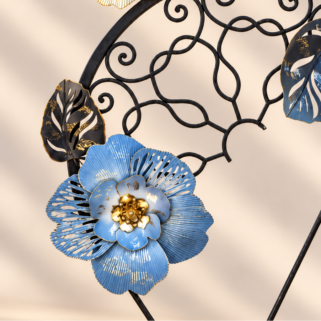 Close-up of blue and gold floral details on the ironwork sculpture