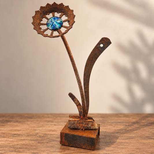 Ocean Iris Bloom, rusted steel gear flower with a blue and teal swirled glass center