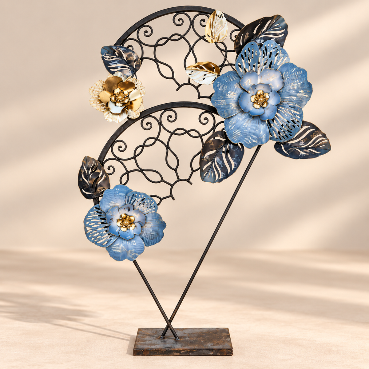 Shifted Flora sculpture with blue flowers on a reclaimed wrought iron gate