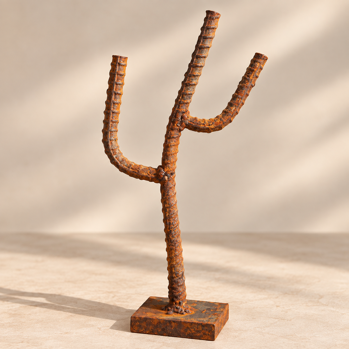 Reclaimed rebar saguaro cactus sculpture with natural rust patina, hand-welded onto a heavy square steel base 
