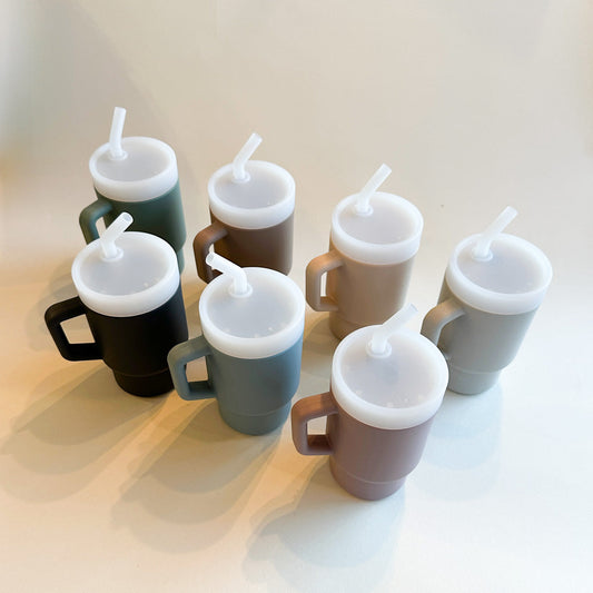 A lightweight 9oz toddler tumbler in soft, premium silicone, designed with a handle for easy grip and portability. The tumbler features a leak-resistant straw with a soft silicone tip, making it perfect for independent sipping. Available in playful colors for kids, it combines functionality with fun for little explorers.